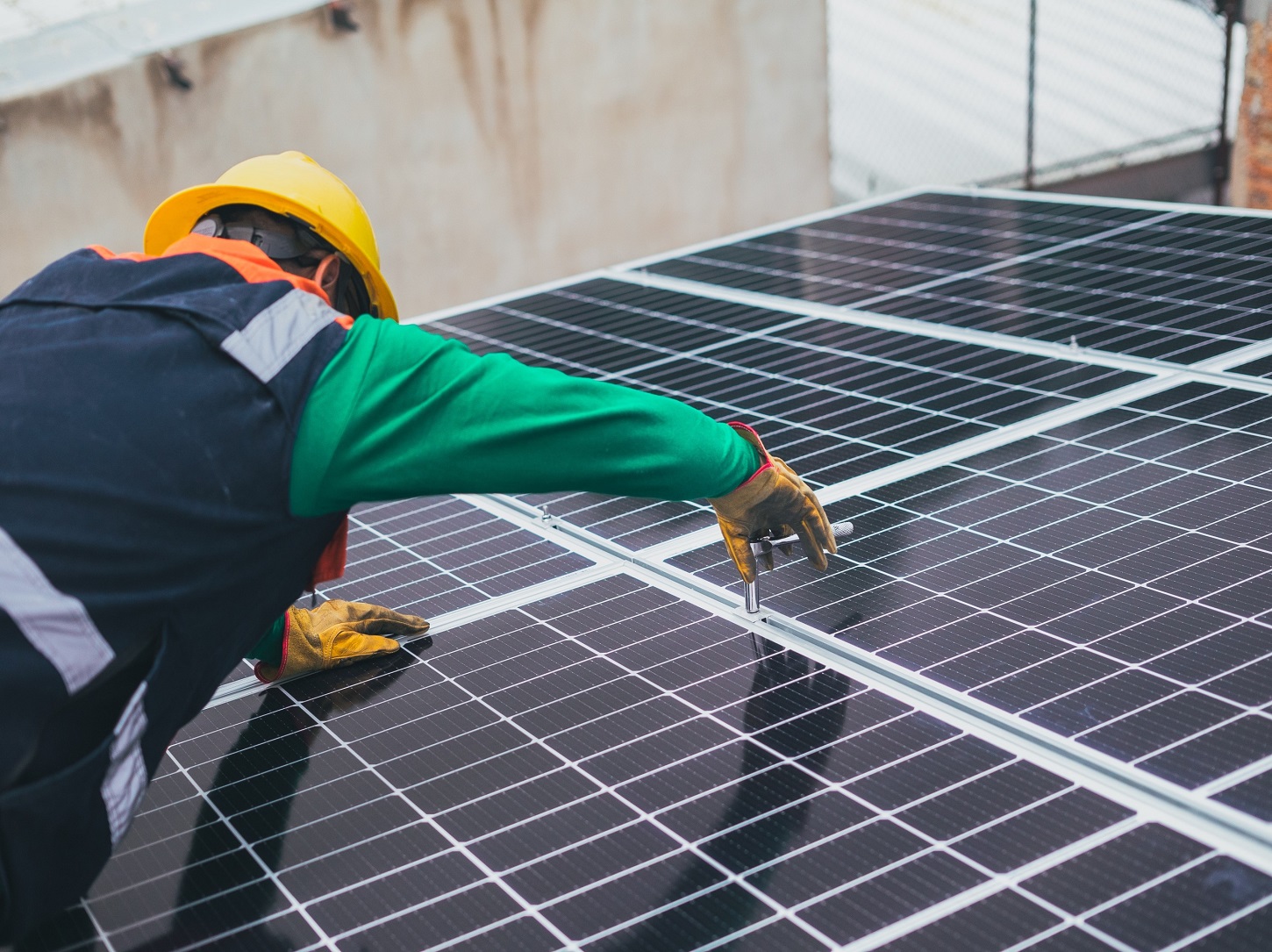 Solar technician installing panels